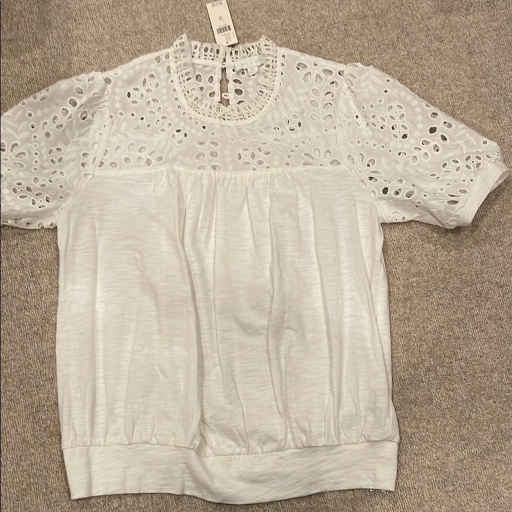 Women’s size medium short sleeve white t-shirt.  New with tags.